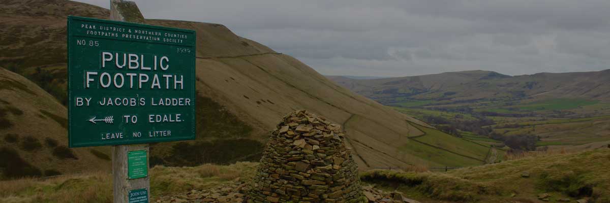 One of our signs near Jacob's Ladder with hills beyond