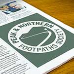 Newspaper with Peak & Northern Footpaths Society logo displayed like a quarter page advertisement