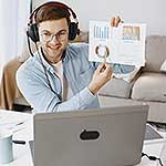 A presenter giving an online talk and showing a graph to the viewers